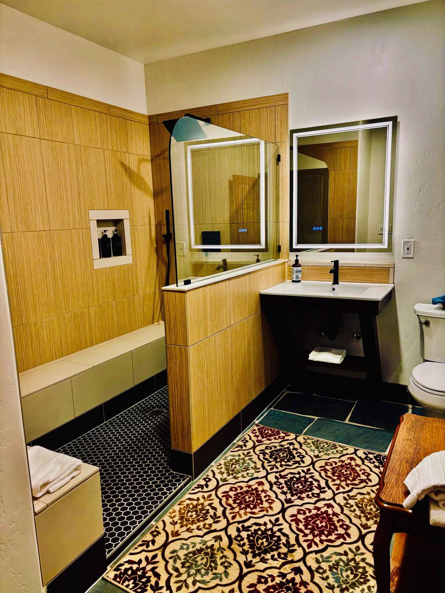 Modern bathroom with walk-in shower and double mirrors