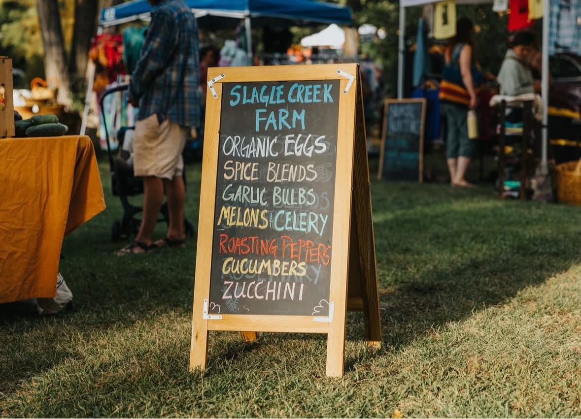 Slagle Creek Farm chalkboard sign at the market